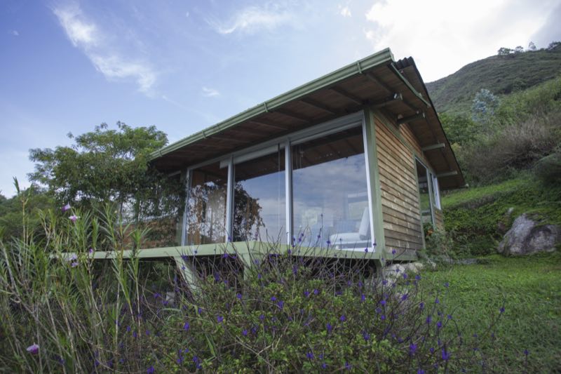 Cabin with big windows facing the valley