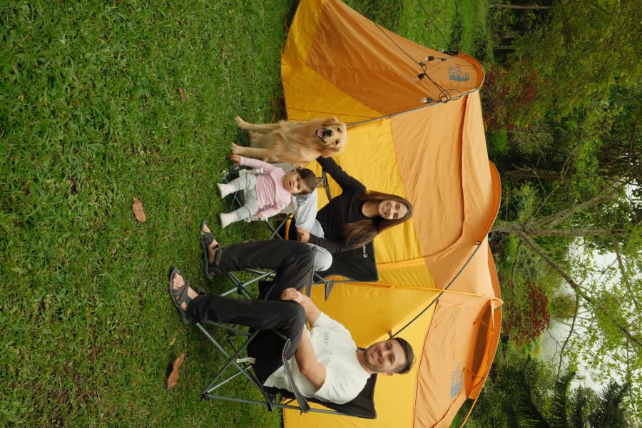 Family camping with their dog